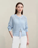 Casual O-neck design with trendy drop shoulder sleeves and delicate hollow knit pattern. This lightweight short cardigan offers breathable comfort perfect for spring layering and everyday casual wear.