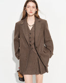 Women's tailored wool plaid blazer in classic tartan pattern, featuring structured shoulders and single-breasted design for sophisticated office or casual chic styling.