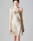Women’s silk camisole slip dress in nude, sleeveless with spaghetti straps, mini length for summer.