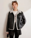Woman layering a thickened fleece-lined denim jacket, vintage wash outside and plush shearling inside—wind-proof warmth for 30-50 °F fall-to-winter weekends.