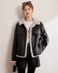 Woman layering a thickened fleece-lined denim jacket, vintage wash outside and plush shearling inside—wind-proof warmth for 30-50 °F fall-to-winter weekends.